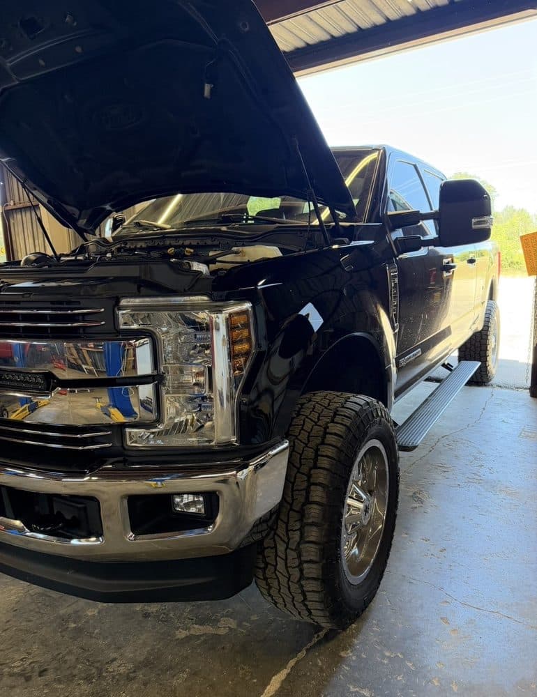 Black Ford Super Duty with the front end disassembled at NorCal Precision Auto in Redding, CA